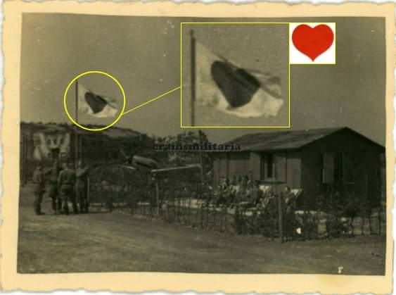 NicoJani2's tweet photo. Very interesting photograph of pilots at readiness with prominently displayed "7./JG 26" flag with the unit's emblem: A simple red heart. Spring 1940. #luftwaffe #Germany https://t.co/tI2rfQz9pl