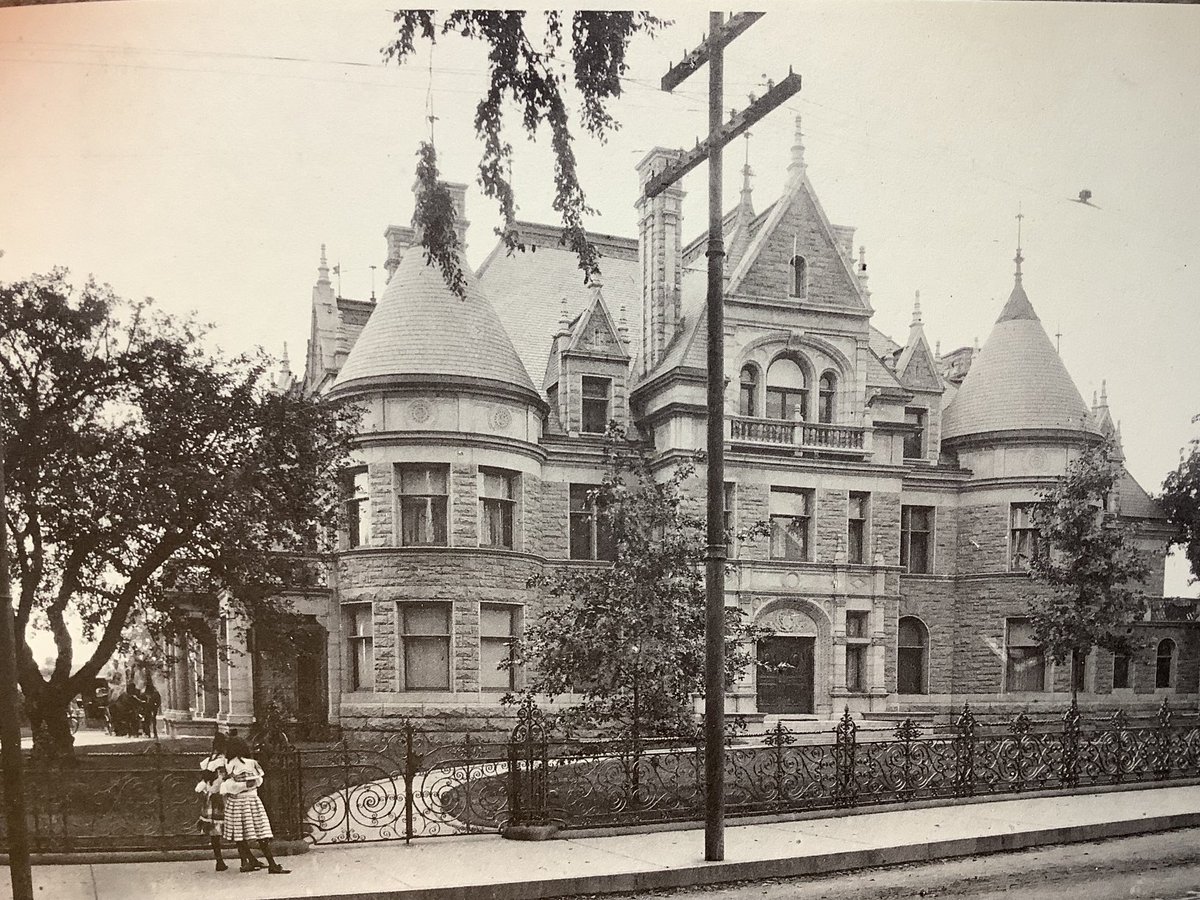 Daniel Wesson built his dream home on Maple Street in the 1890s. Dubbed “Fort Wesson” by the newspaper, the interior featured gold plumbing fixtures, exotic wood walls and paintings on the ceilings. Two little girls watch in awe as the coach arrives on the left of the picture.