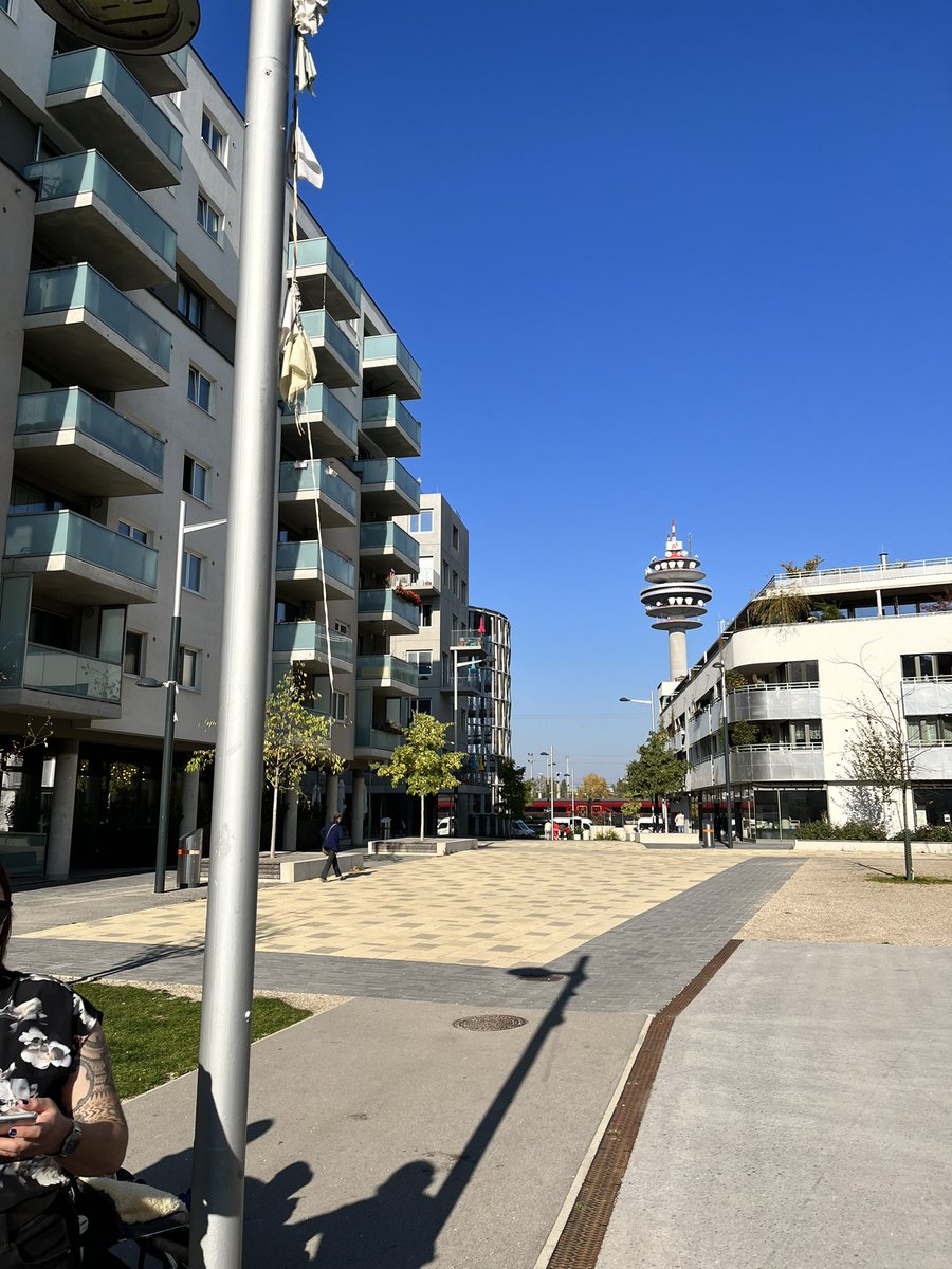 EmilyAssembly's tweet photo. Now touring a co-op building. Car free with lots of families. This is a mix of market, coop, & limited profit housing. The complex comes from a contest for best design instead of highest bidder. Open space has gardens, new school, hotels & cafe. #wheninwein 2 bdrm = $600 a month https://t.co/u2hpyjqKFL