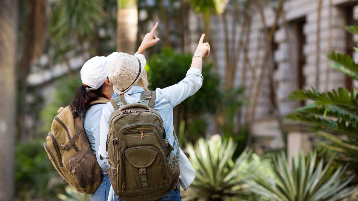 Tourists pointing at a building.