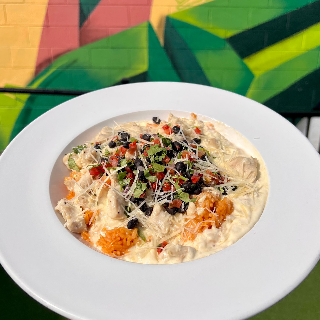 This week's "Off Menu" Special: Jalapeño Chicken Bowl! Grilled chicken chunks and tomato rice topped with fresh black bean salsa, parmesan cheese, and a house-made creamy jalapeño queso