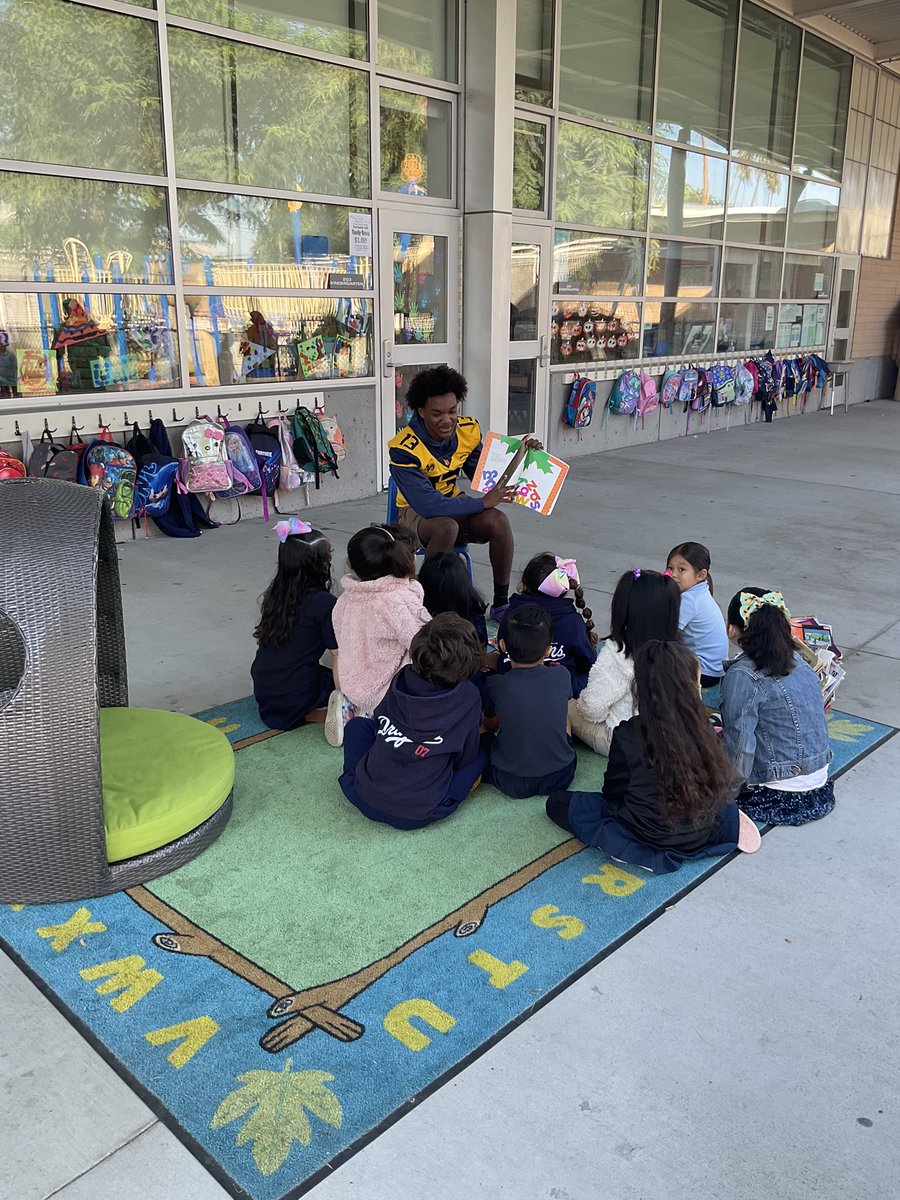 MillikanHSFB's tweet photo. #RamsInTheCommunity Long Beach Millikan Football players reading to kindergarten students this morning at Dooley Elementary School @DooleyDragons #WinTheDay https://t.co/buMg0yAPkq