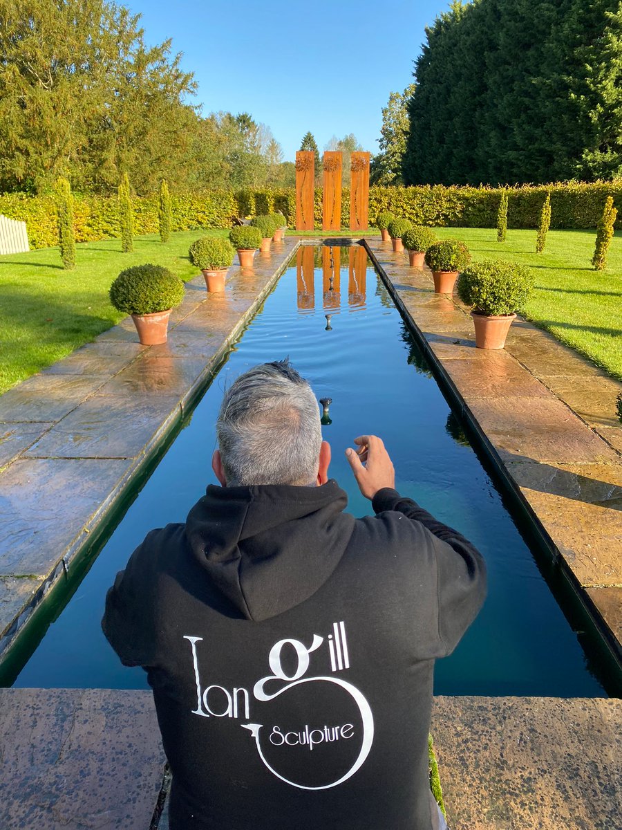 Ian inspecting his work (yes, definitely level!) during the 'Make a Wish' installation at <a href="/TheGardenBarn1/">The Garden Barn</a> – a #weddingvenue in Suffolk – last week.
#scuplture #art #makeawish #dandelion #cortensteelsculpture #gardenart #gardensculpture