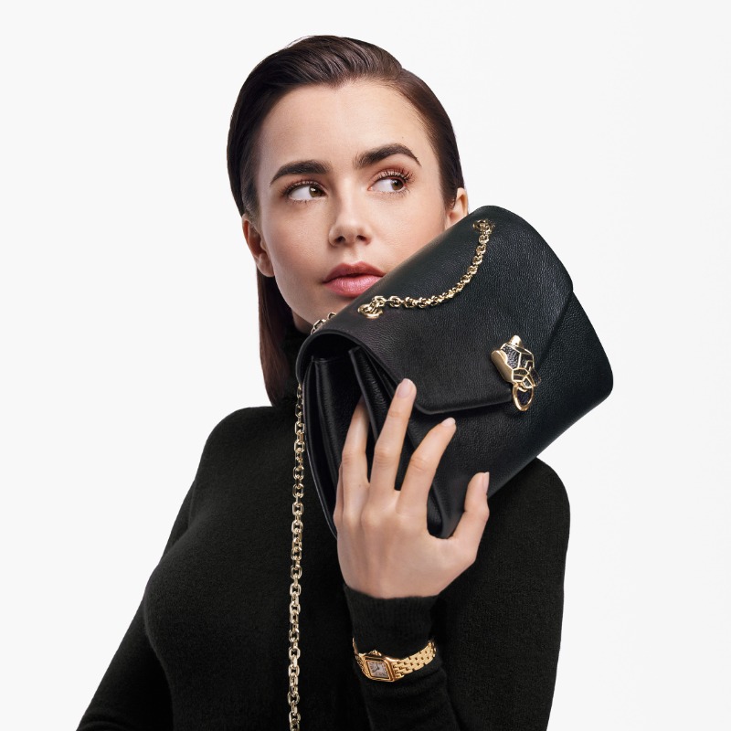 Cartier's tweet photo. Complex, alluring, utterly magnetic. The spirit of the new Panthère de Cartier bag is embodied by the inimitable Lily Collins. #PanthèredeCartier