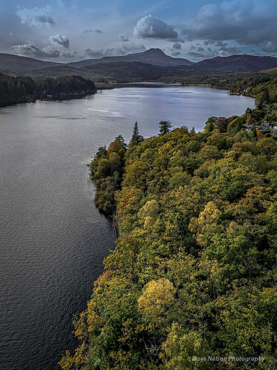 An aerial view of Loch Ard with the towering peak of Ben Lomond on the horizon.
The trees lining the loch are starting to display their autumn colours.

#scotland #lochard #benlomond #trossachsnationalpark #trossachs #aerialphotography #djiglobal #water #loch #mountains #autumn