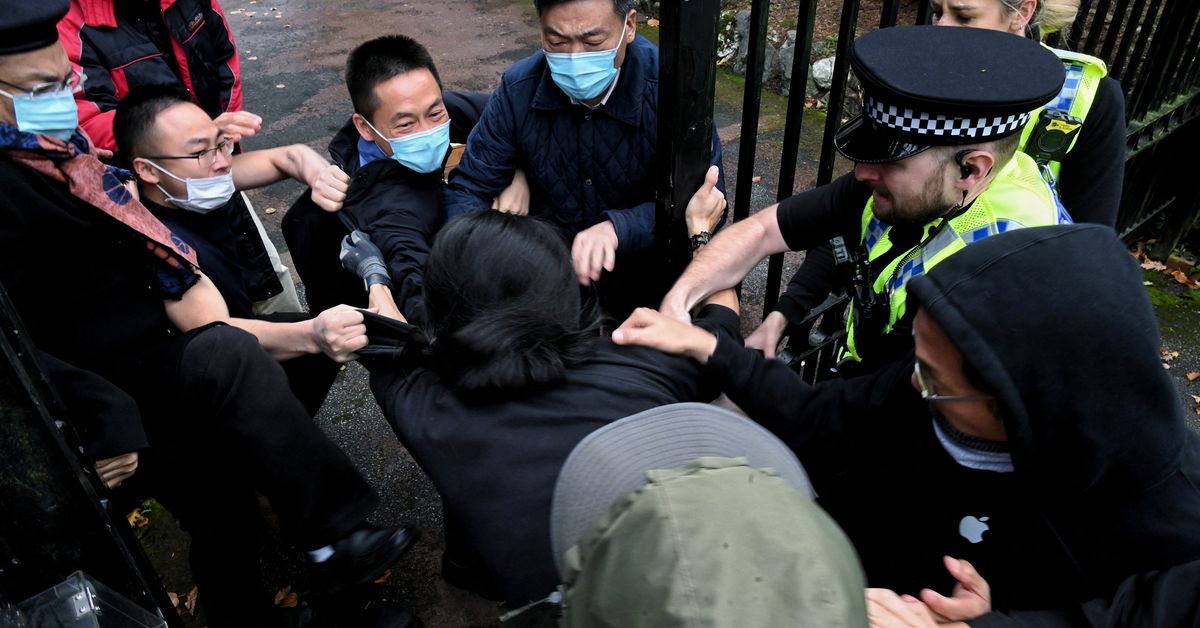 ReutersWorld's tweet photo. UK summons Chinese envoy over protester beaten at consulate https://t.co/ivSvOjTKdR https://t.co/cReD6CsxzQ