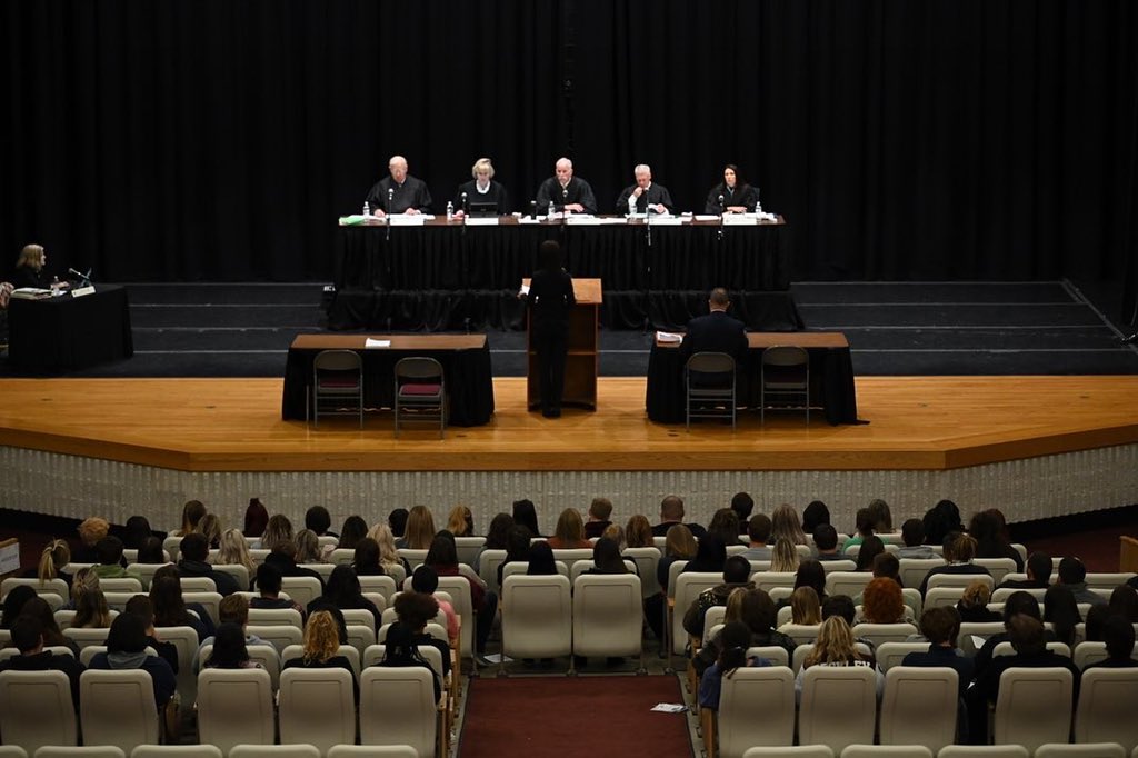 WVcourts's tweet photo. The Supreme Court heard arguments remotely today, Oct. 18, 2022, at Woodrow Wilson High School in Beckley, WV.  The arguments are part of the LAWS program, which exposes students to actual Supreme Court cases at a venue in their local community. https://t.co/qzTyeN3vc8
