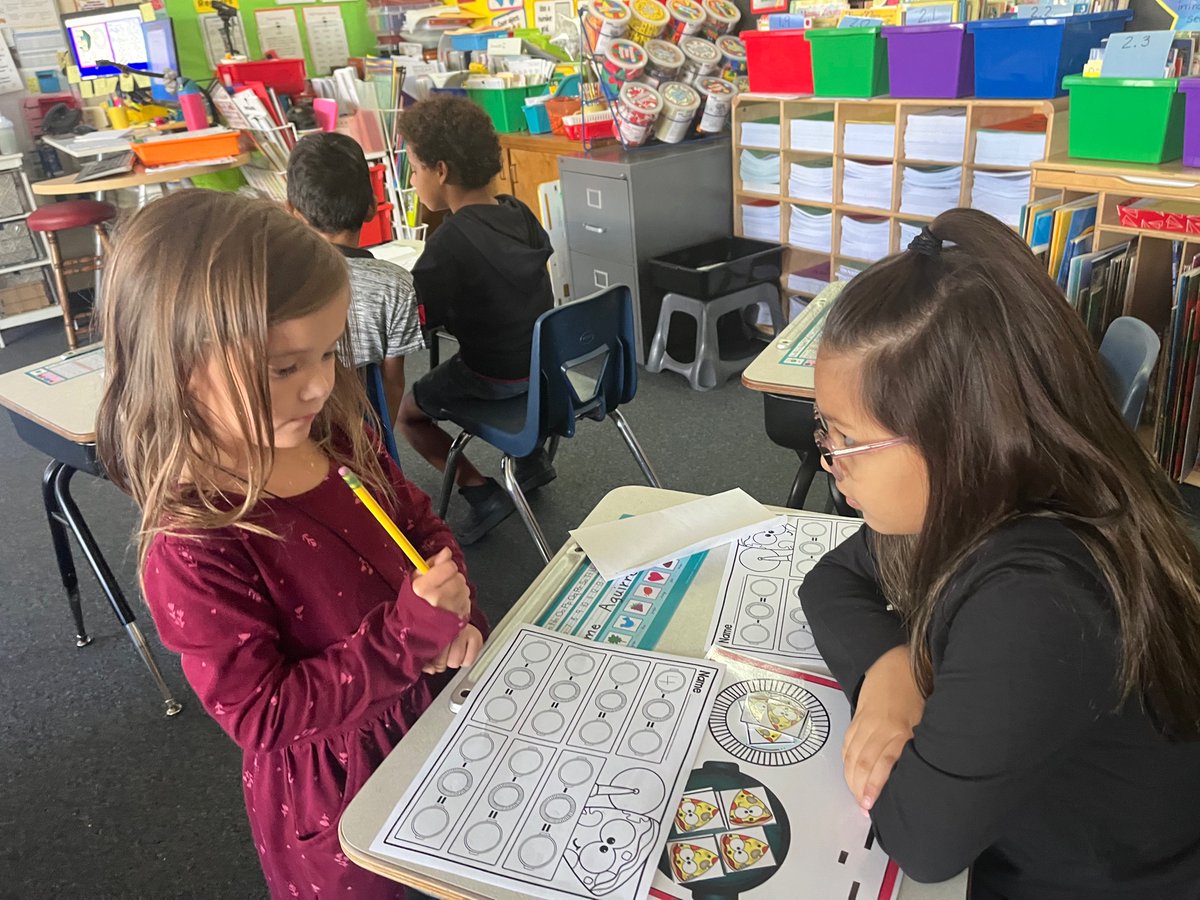 Mathematicians working together to solve subtraction problems.