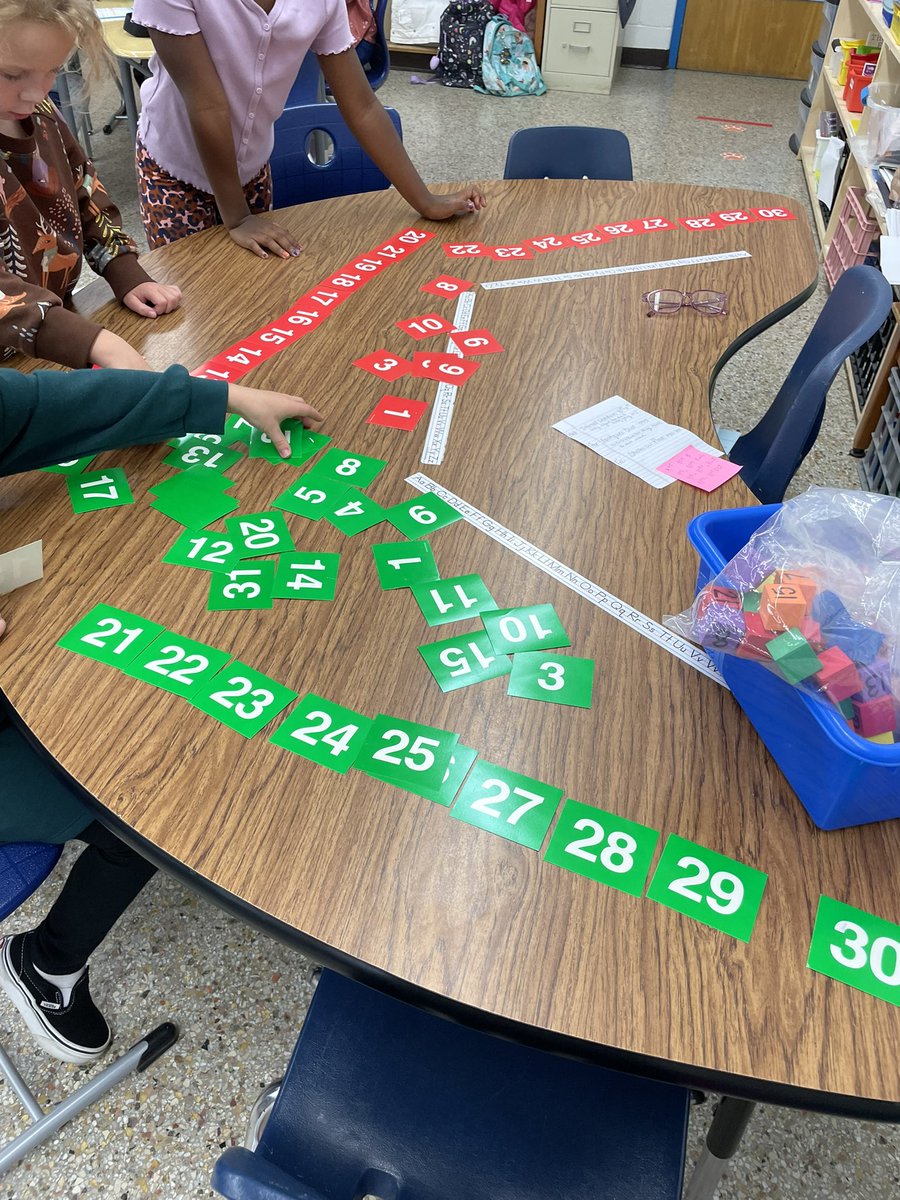 Firsties enjoying math stations.