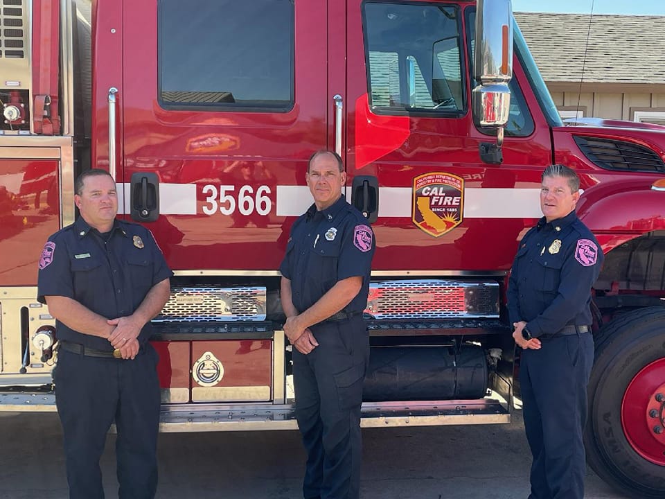 CAL_FIRE's tweet photo. @CALFIREBDU Chief Shane Littlefield &amp; Asst. Chief Ron Janssen stand with Capt. Steve Volmer by caring enough to wear pink. Capt. Volmer's wife is a cancer survivor. Follow us as we highlight our units supporting #BreastCancerAwareness via the “Cares Enough to Wear Pink” campaign. https://t.co/JZLVEqHVTr