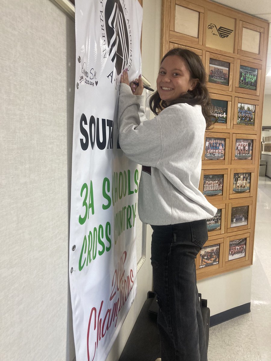 EagleButtePRSD8's tweet photo. EBHS Cross Country #kindlehearts #forgefutures with international students. Emma Sumay Miquez and Martina Duo signing the South Zone banner #myprps #abeb @PrairieRoseSD8 https://t.co/8fKTJLi258