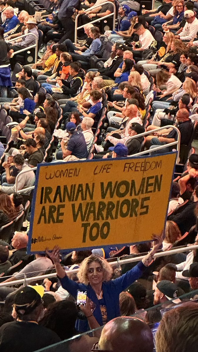 BenGolliver's tweet photo. Sign at Warriors/Lakers opener: “Iranian women are Warriors too” https://t.co/RyLSG1P8DD