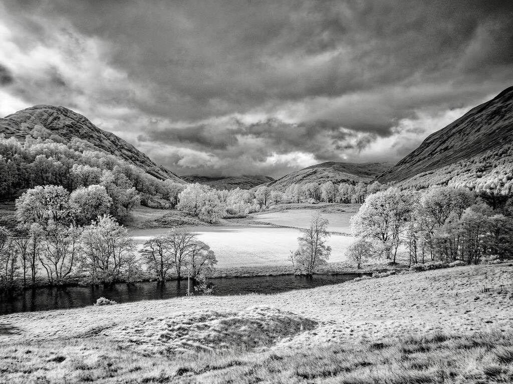 Infrared - Looking west along Glen Lyon from Camusvrachan, Perthshire, Scotland. Olympus Pen-F IR 720nm modified + Lumix 20mm f/1.7. olympusuk @ElyPhotographic #omsystem #infrared #landscape #scotland #scottishhighlands instagr.am/p/CkK-gmzqUA6/