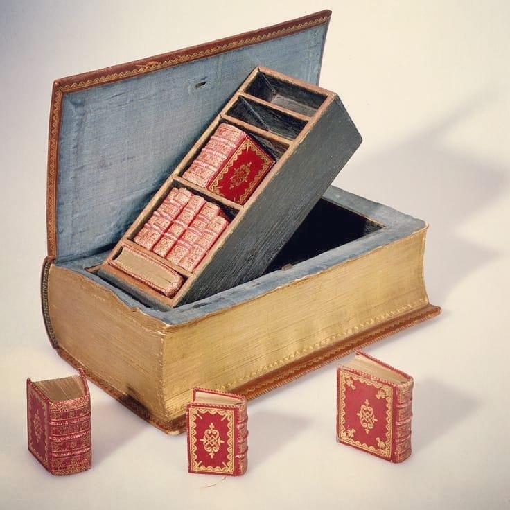 A 18th century book containing tiny books on a pop-up shelf, made by a bookbinder in the Netherlands around 1757. The National Library of the Netherlands.