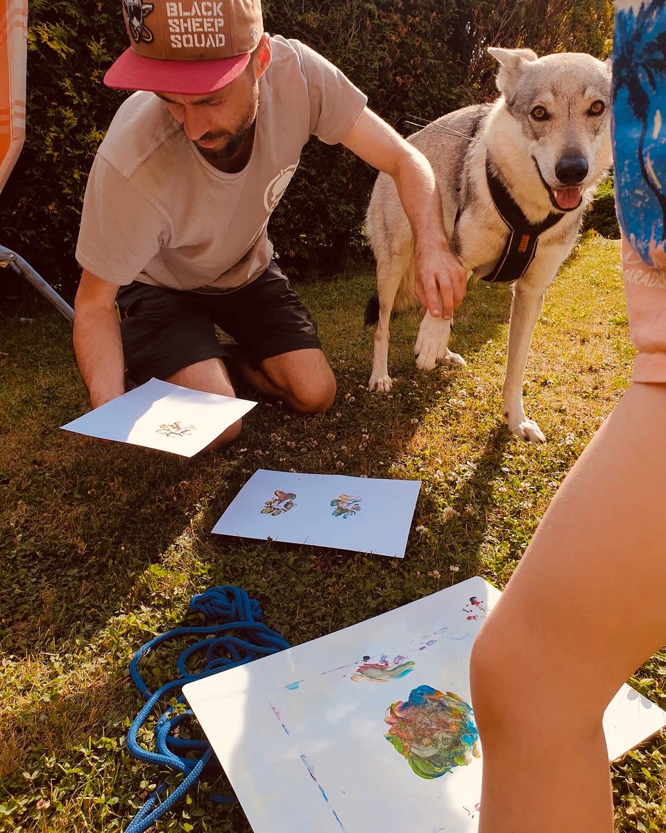 WolfdogCure's tweet photo. this is how we create them together :) the children paint, "Aira"(wolfdog) makes a paw print and nature photos merge into pictures 🐺 https://t.co/wTo7HrtqsW