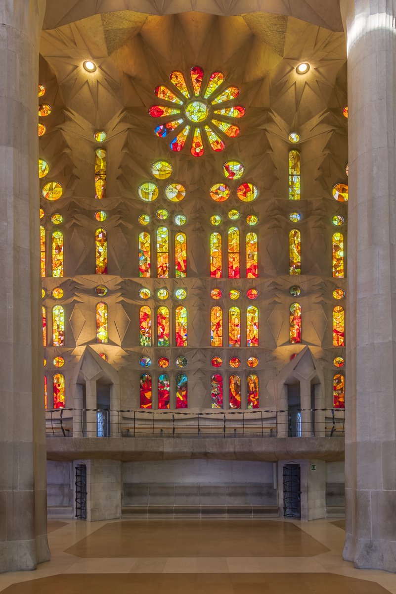 The windows on the Nativity façade have bluer tones, corresponding to the morning light; while on the opposite side, they are more orangey, like the evening light.