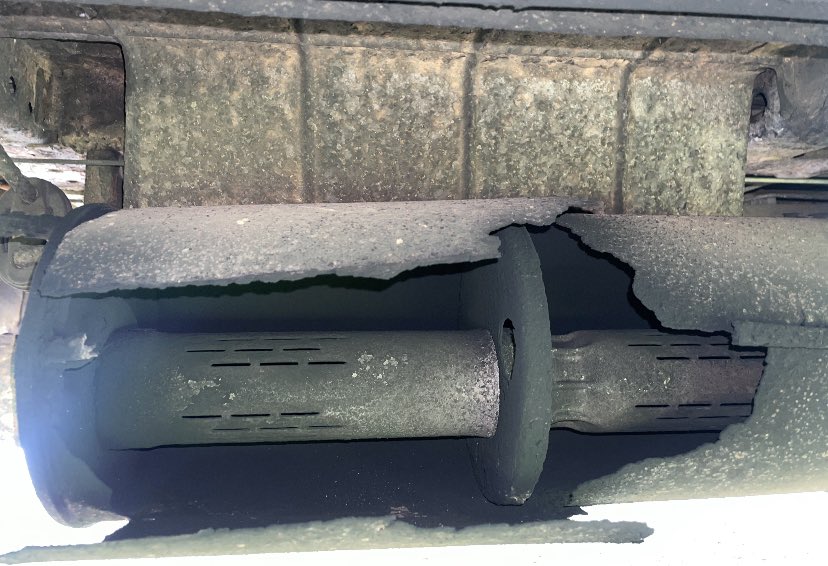 DVSAEnforcement's tweet photo. This van should be in a motor vehicle college,it could show trainee mechanics the inner workings of an exhaust system!🚚💨

Prohibition issued by the team at Switch Island🚫

Hopefully the missing fragments didn’t cause harm or damage to other road users😬

#MaintainYourVehicle https://t.co/Z8uQAJYVZ5