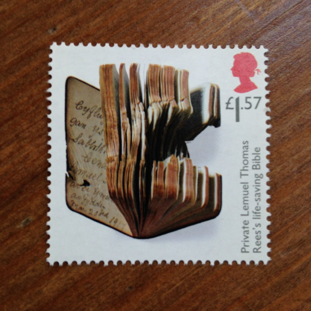 heledd_lyne's tweet photo. @MrSHowe3 Stamp cafodd ei wneud gyda llun o’r Beibl wnaeth achub bywyd brawd hen-Dadcu Anwen yn ystod y Rhyfel Byd Cyntaf https://t.co/Gu0g7scLez