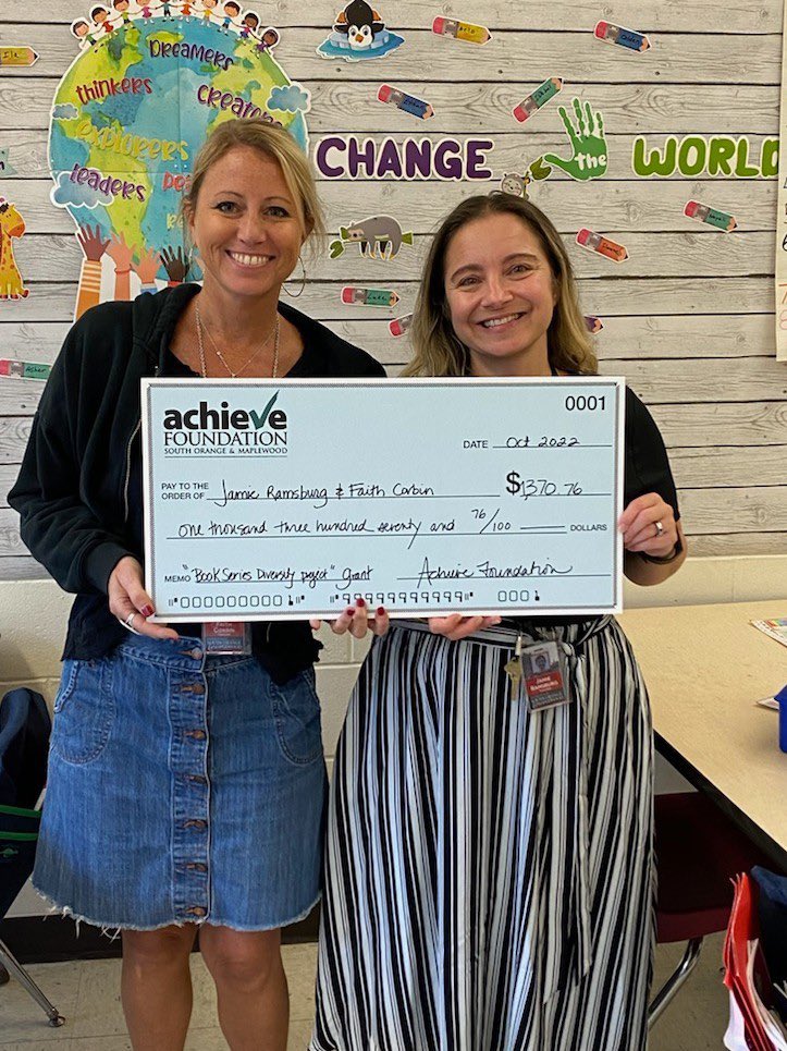 Two of second grade teachers receive their check from Achieve Foundation!