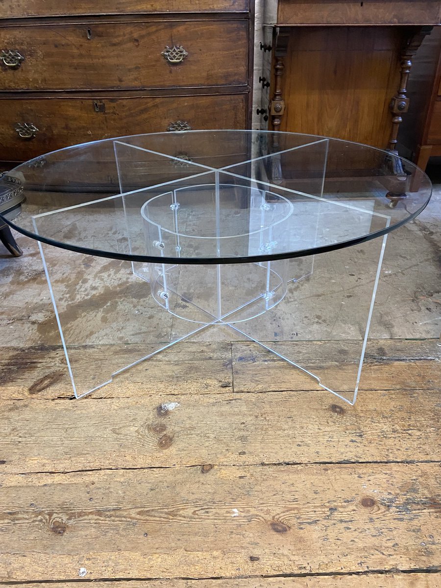 Coffee table with Perspex base and glass top.
81cm diameter 38 cm high.
£125.
One Perspex dowel missing.