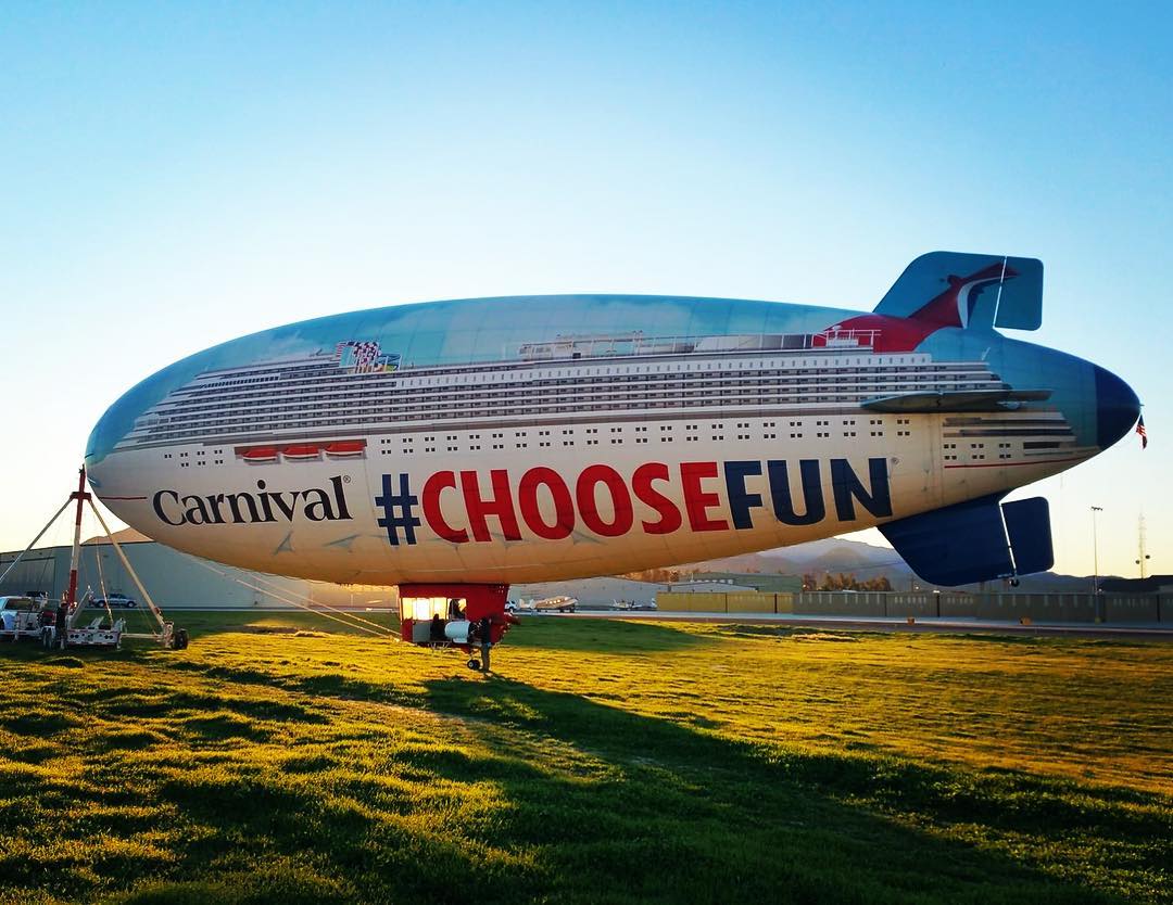 AirSign's tweet image. For one and a half years, we delighted to fly our blimps for Carnival Cruise Lines. It remains one of the most memorable and iconic campaigns we have ever done. Can anyone remember the story of how they first saw this blimp flying in the sky? 🚀🌅 #TBT