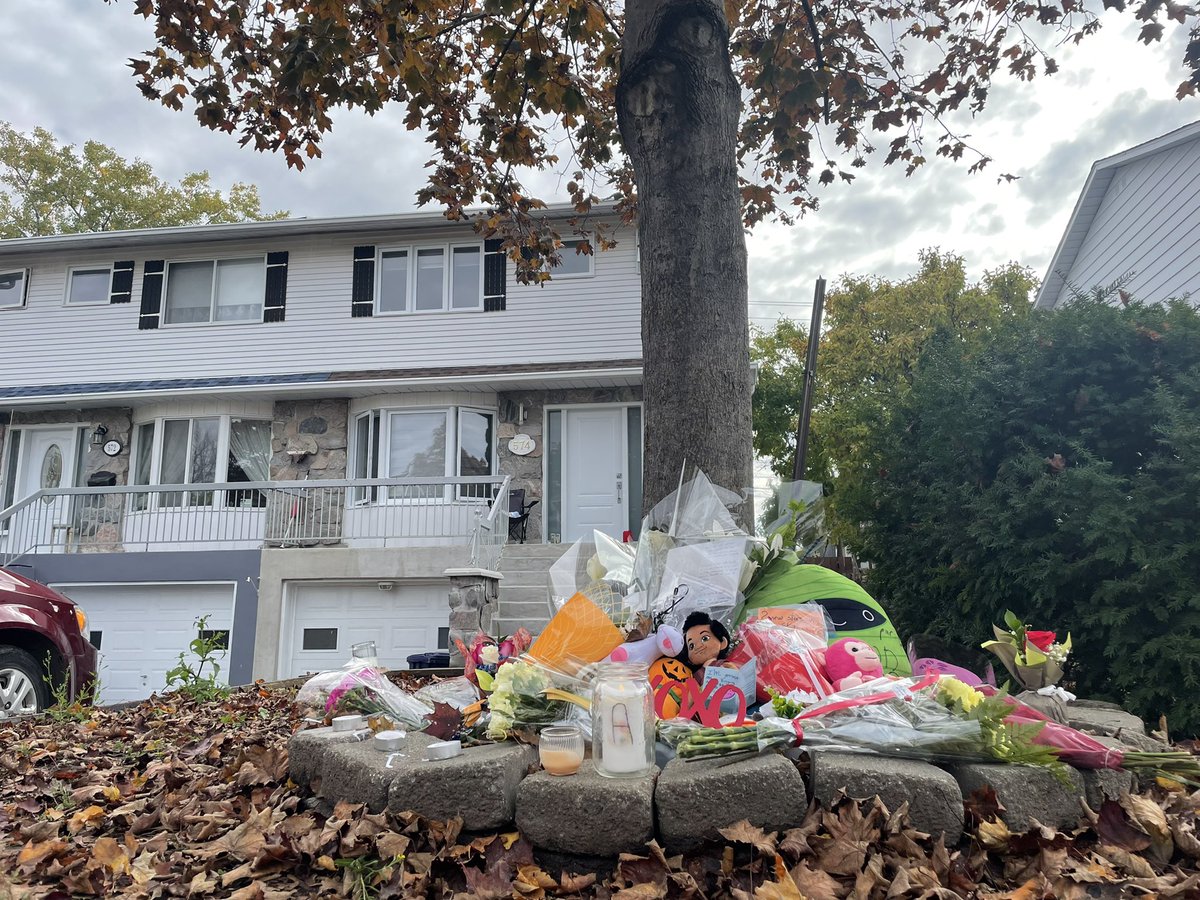 Flowers, letters and stuffed animals were layed out at the home where two children were killed in Laval. Their father expected to appear in court Wednesday afternoon.