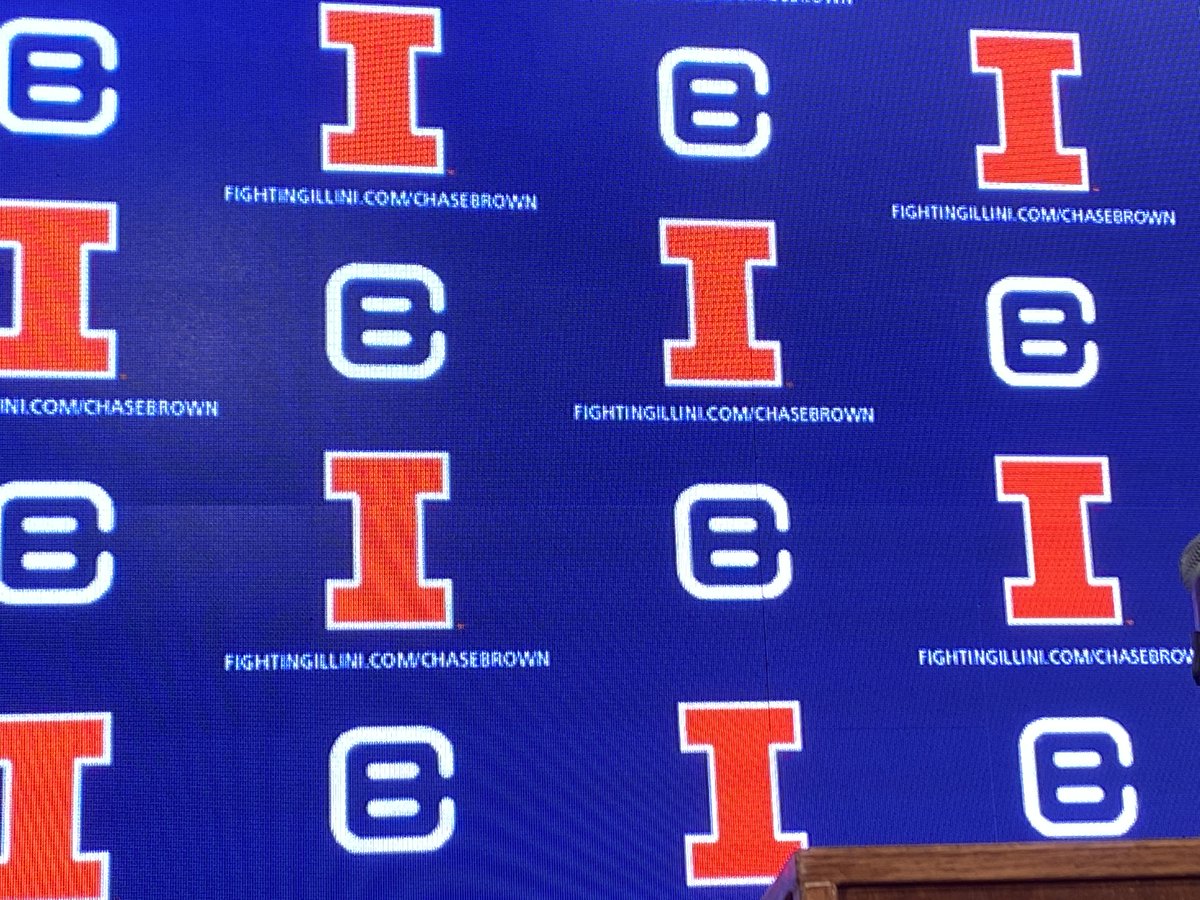 Chase Brown about to take the podium (!) and #illini have his own digital backdrop, including his own personal logo.