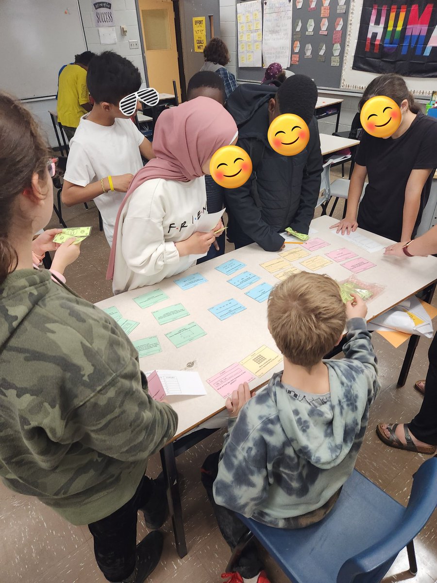 Grade 6 Singer <a href="/RHS_HRCE/">Rockingstone Heights</a> fully engaged in their afternoon math market! Questions based on the practice test for the RWM6.