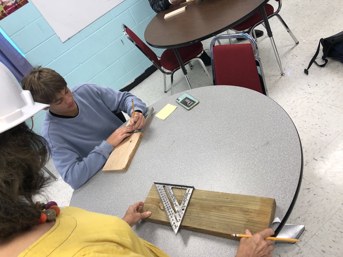 SraExumGHS's tweet photo. Workplace Spanish students taught their visitor, Longwood Spanish Professor Emeritus, Dr. Goetz, how to use the escuadra rápida en español! #bold #authentic #handsonlearning #sointimidating @GHSCollier https://t.co/X7UFVjczfK