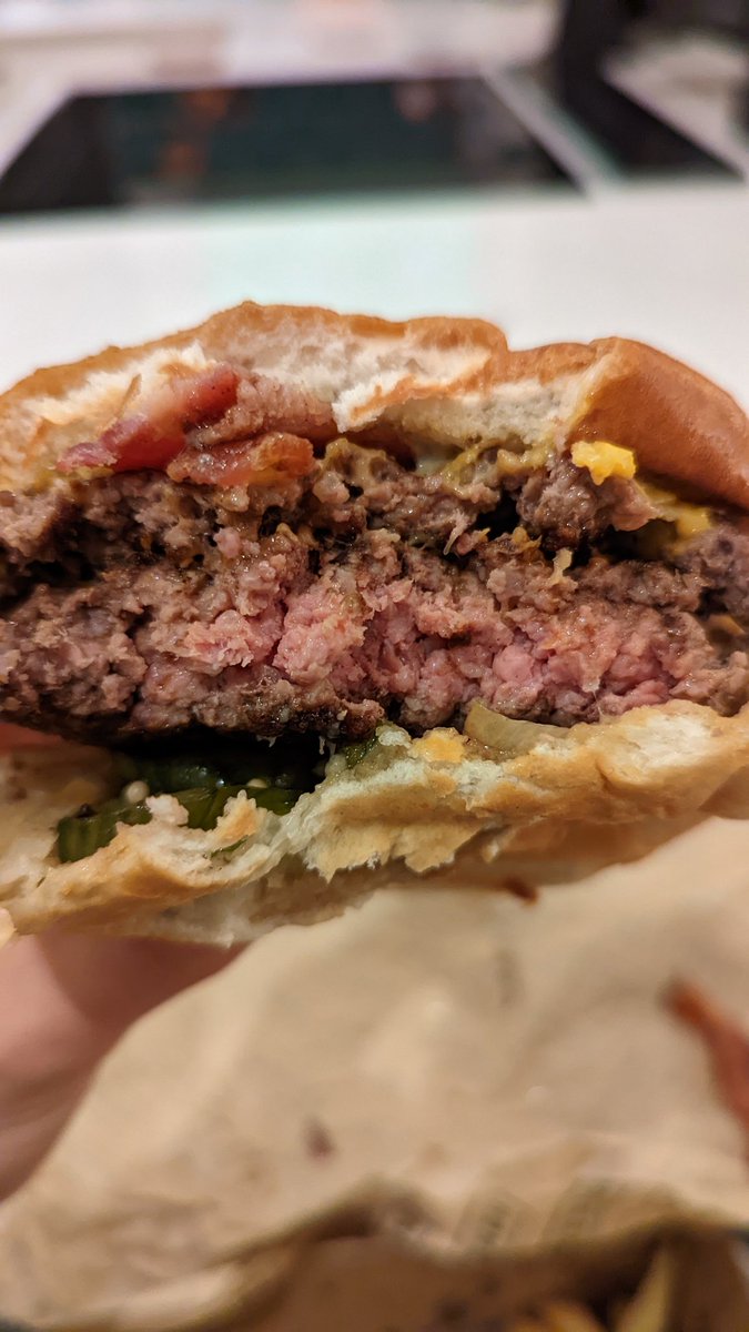 stenard's tweet image. Ordered two @honestburgers via @ubereats_uk, including a "well done" order for my pregnant partner. Thankfully I ordered a new smashed burger for myself which automatically come cooked through, because we had to swap patties as this is what "well done" came as.