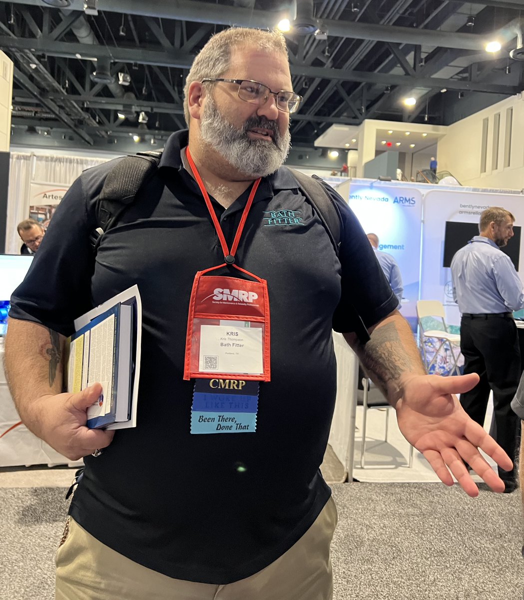winreliability's tweet photo. #SMRP 2022: Amazing Kris Thompson of Amazing Bath Fitter stops by to meet us, learn about CDG, &amp; get a signed copy of Donald Nyman’s latest book co-authored with Bill Mountjoy, "Maintenance &amp; Operational Reliability”. Stop by Booth 100 to get your copy! #MVPCMMS #MVPOEE https://t.co/aFovInbCeu