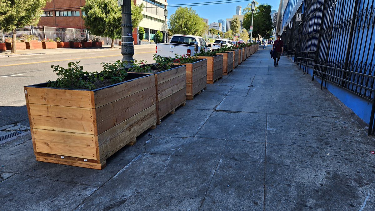 LATACO's tweet photo. Dozens of newly installed planters in Westlake near Wilshire and Bonnie Brae. In the past planter boxes and boulders have been used as a tool to displace unhoused residents and street vendors. Some have been there for atleast 2 yrs, these were added recently. Via: @ShotOn35mm https://t.co/EvQqmtjAzl
