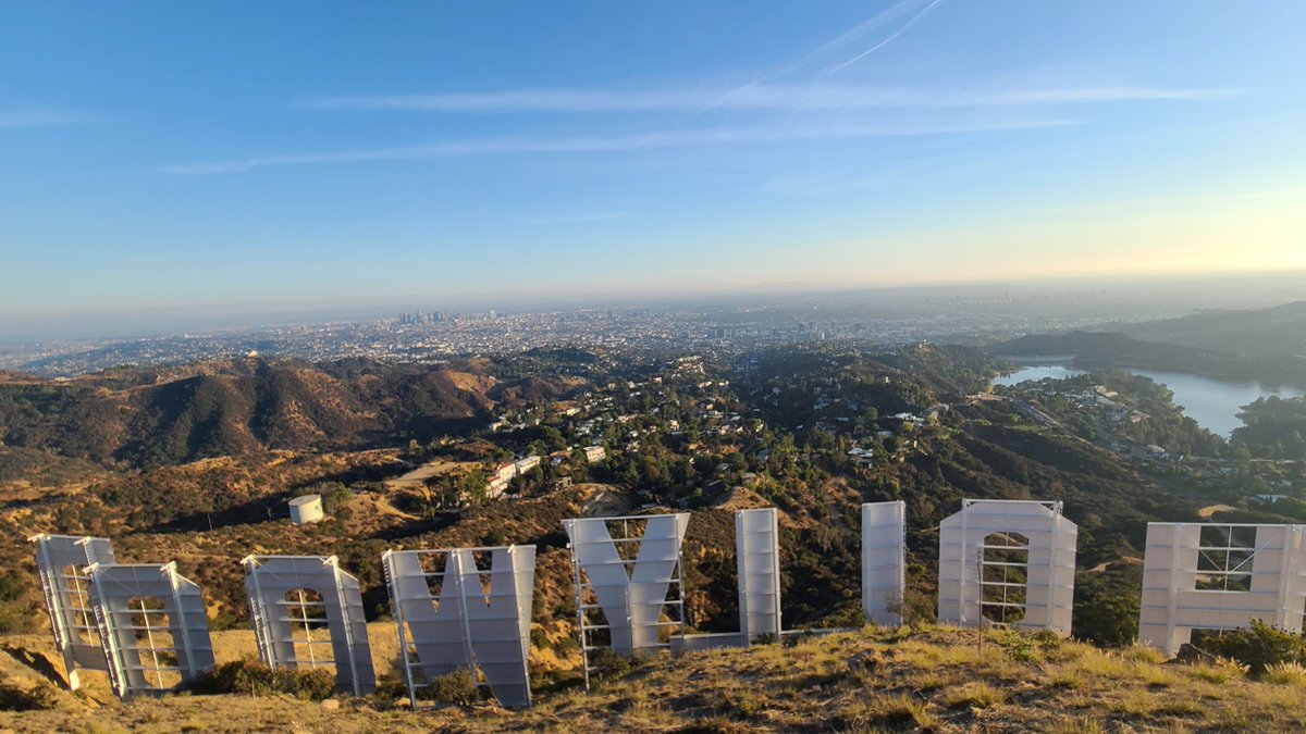 Behind the sign!