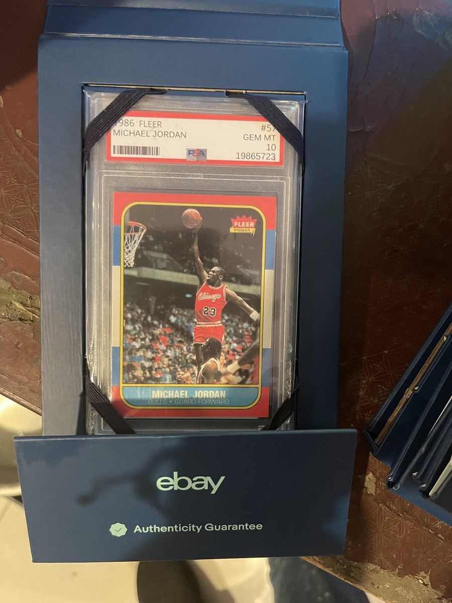 Now the bad guys are using eBay sleeves to try to pawn off laughable fakes. Check out the comical cert number.