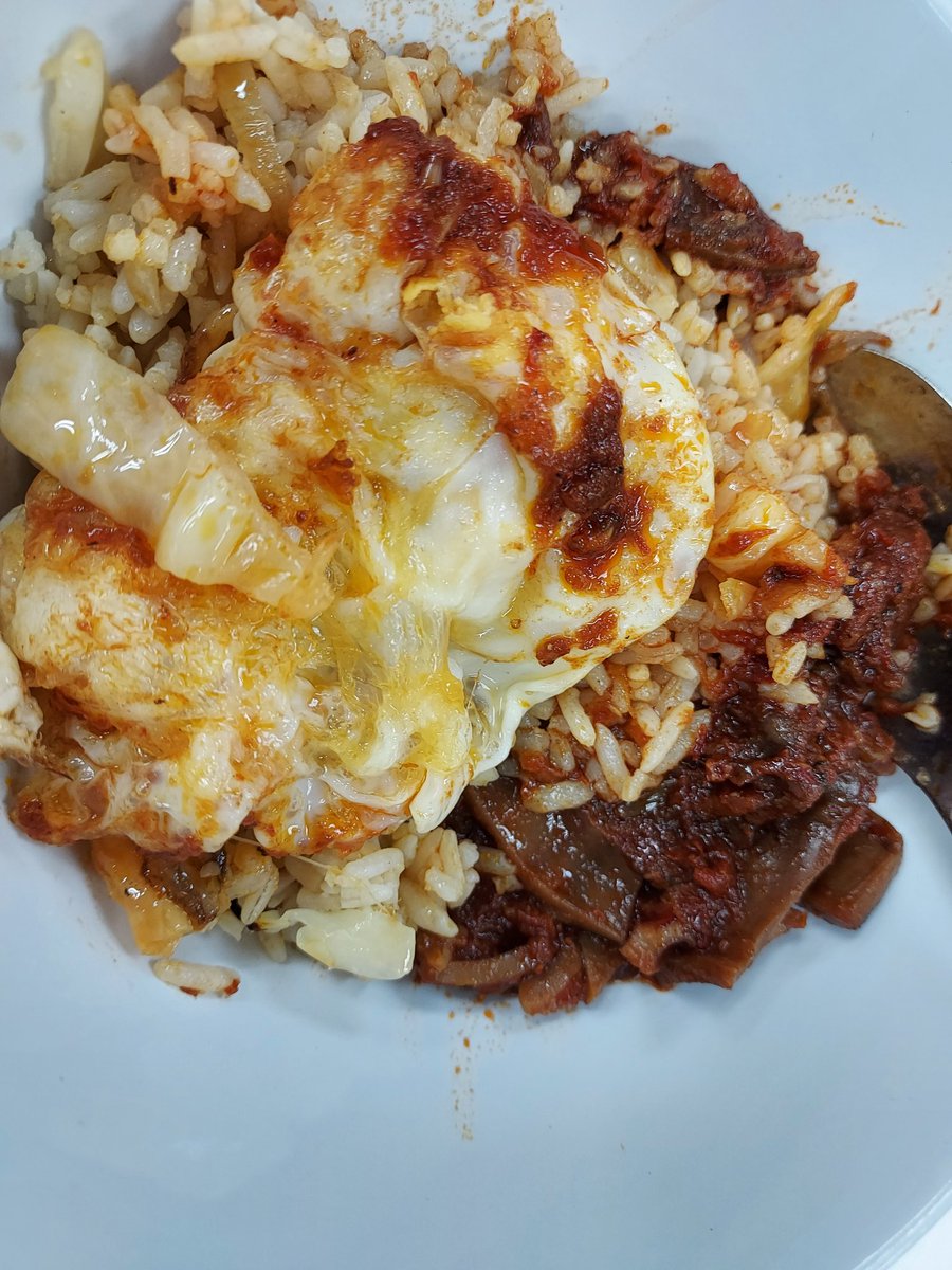 Eva7314's tweet photo. I know it looks unappetising but it was delish. Nasi goreng with sambal sotong and telur mata... https://t.co/94aWA3Ntla