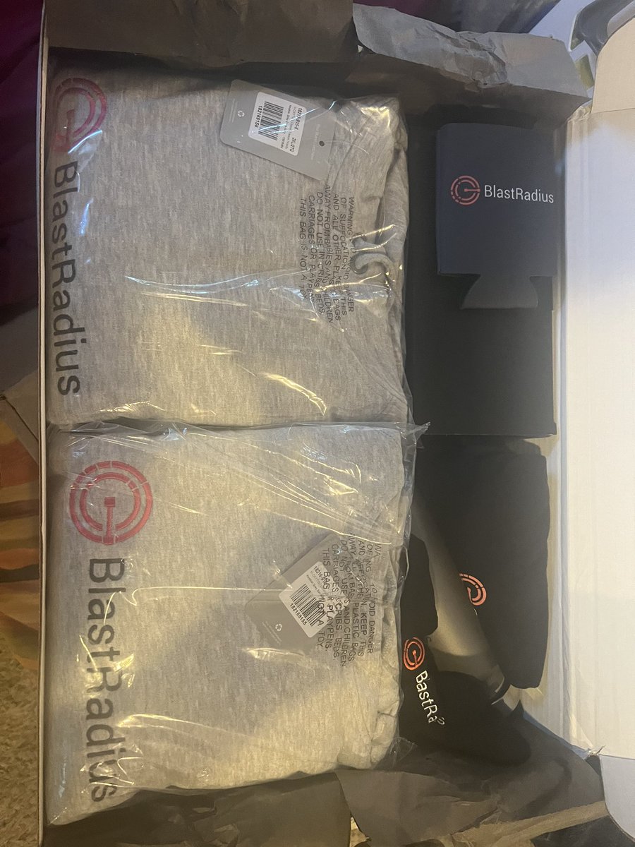 raknak's tweet photo. @jrichlive @HYCUInc @silverfort Update: This just arrived from @BlastRadius_AI. Shock and awe approach to swag. (Which I am both)  

Picture doesn’t quite do it justice there are things underneath the things underneath the things you’re looking at (and the repeated underneaths are not a mistake) https://t.co/dQxS8wtzRI