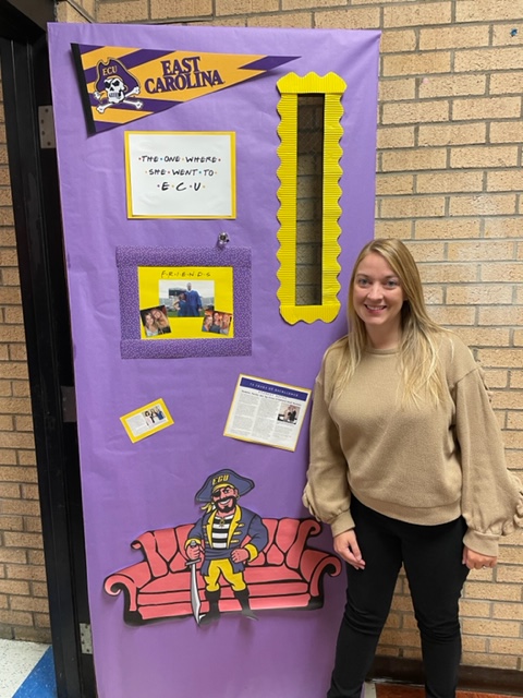 CTE_HuntHS's tweet photo. CTE teachers Mrs. Moore @ECUAdmissions and Ms. McCance @CLT_Admissions compete in the door decorating contest. 💙 @CFNC #collegeapplicationweek https://t.co/n5xPPcBfAw