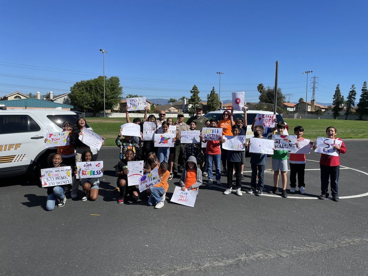 CJUSDSafety's tweet photo. @fontanastation #SRO/Deputy Dominguez brought backup to help spread messages of #kindness @JVRoadrunners. #Students were even sworn in as #JuniorDeputies before taking a group picture at today’s #UnityDay22 celebrations. #KindnessBus #BullyingPrevention #SBCSD #cjusdS3 https://t.co/qVejgAnrPj