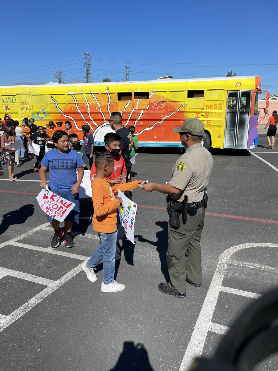 CJUSDSafety's tweet photo. @fontanastation #SRO/Deputy Dominguez brought backup to help spread messages of #kindness @JVRoadrunners. #Students were even sworn in as #JuniorDeputies before taking a group picture at today’s #UnityDay22 celebrations. #KindnessBus #BullyingPrevention #SBCSD #cjusdS3 https://t.co/qVejgAnrPj