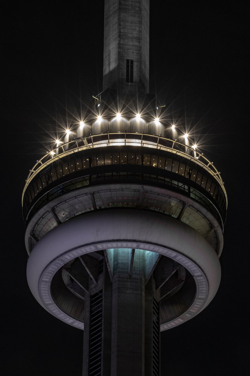 TourCNTower's tweet photo. Tonight the #CNTower will dim for five minutes at the top of each hour in memory of Constable Morgan Russell and Constable Devon Northrup of the @SouthSimcoePS, who died in the line of duty. https://t.co/Rp4JHy0ED2