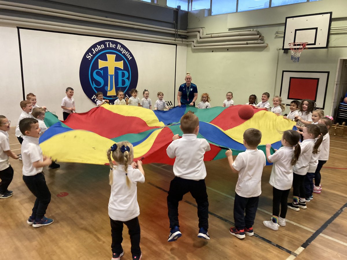 SJBPS11's tweet photo. Coach Anna from @MaloneCollege has been leading the P1 children through parachute games this morning as part of our Fitness Fun Day. #SJB https://t.co/P1OsTSLUMk