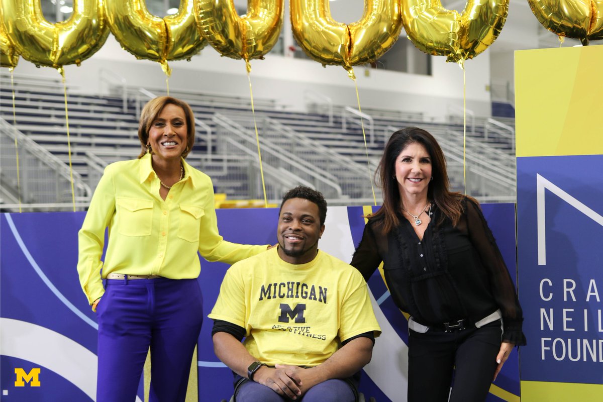 UMich's tweet photo. This morning, @RobinRoberts and @GMA visited U-M to surprise Dr. @Okanlami with a $1 million award from the @NeilsenFndn to help further advance his work with @UMAdaptive Sports & Fitness. Learn more about Dr. O's efforts and watch the live segment: https://t.co/0weDzHffWJ https://t.co/SuNqqF8iri