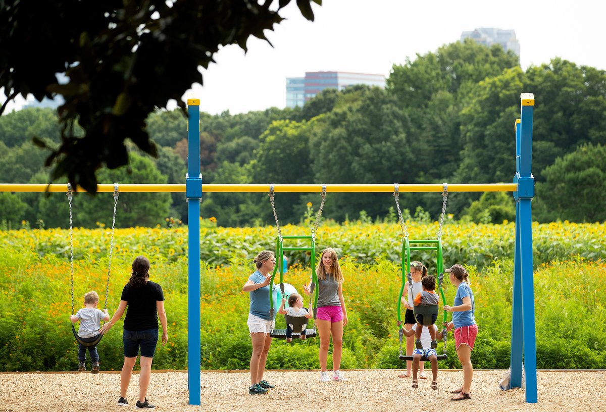 gametimeplay's tweet photo. We know it's Autumn, but we aren't ready to let go of summer yet. These photos of families enjoying the sun and the sunflowers make us smile! #expressionswing https://t.co/1xWmli6kwF