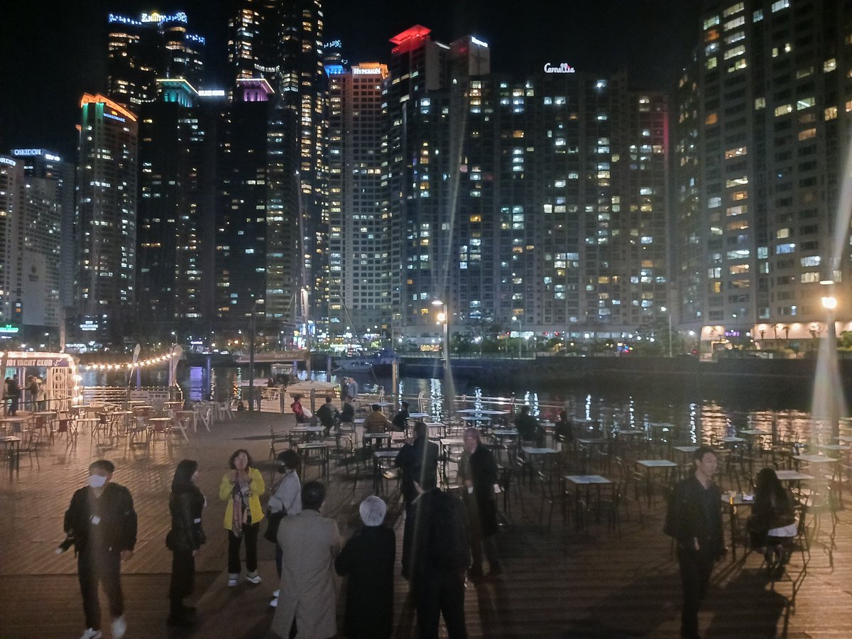 hmc474's tweet photo. A colourful nightscape of #Busan South Korea from International Film Festival building to waterfront landmarks. An amazing end to day 1 @LUCIassociation #luciAGM #lightplan #playfullight #citytocitylearning https://t.co/AcX5vy4ZuV