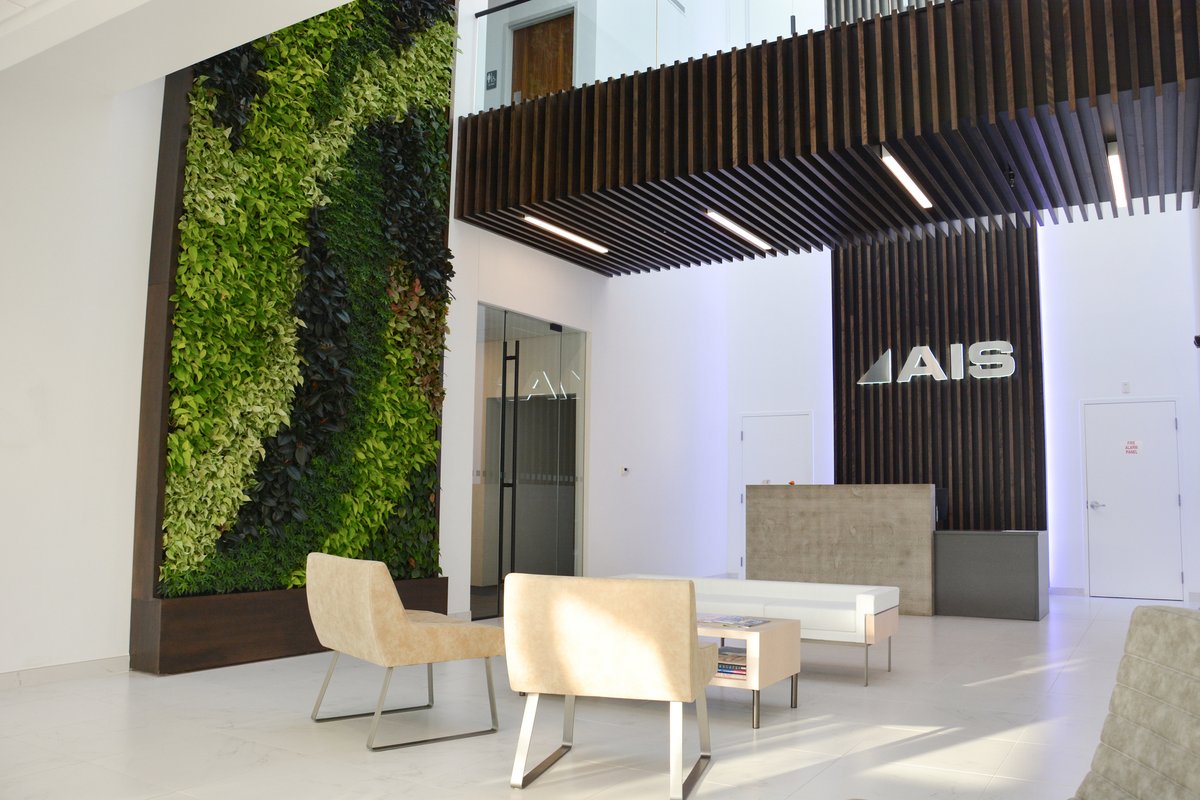 📍AFFORDABLE INTERIOR SYSTEMS, INC | New York 🌱Upon entering the space, customers are greeted by a two-story lobby featuring a 20-foot-high green living wall that is reflected in the impressive full skylight above. #biophilia #greenwalls #architecture #design #interiordesign