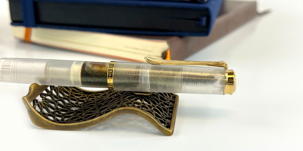 PenChalet's tweet photo. Guess who's back?! The Infinite Stars pen stand is back again!⭐ It sold out quick when it launched, so jump on and get one now if you've been eyeing it:
https://t.co/pVdE1YcAwT #sepiawritingaccessories #sepiapenstand #pelikanpen #pelikangoldenberyl #fountainpenholder #penrest https://t.co/1t9dijHm2z