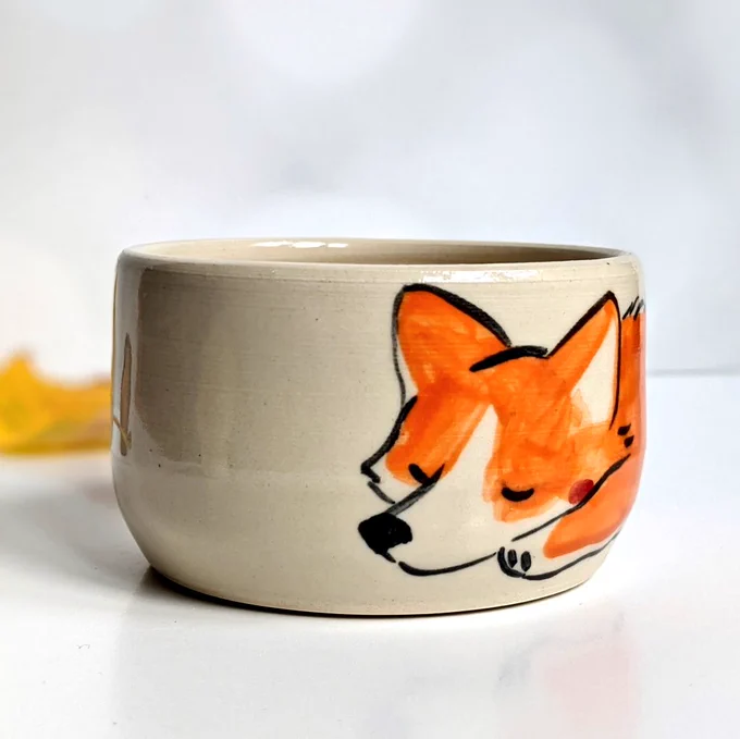 A long dog, a small piece of pottery  