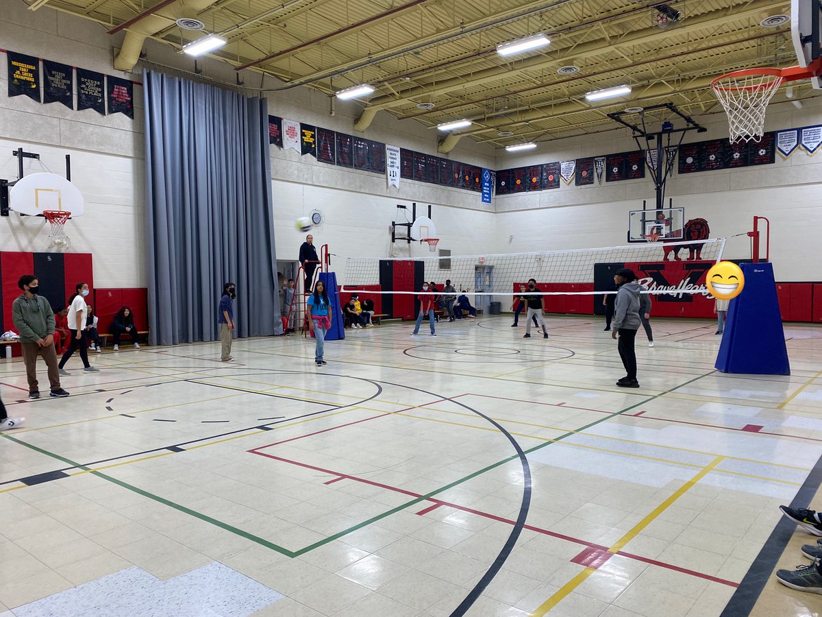 CoutoMr's tweet photo. Grade 8’s classes beating the rainy weather (and showing off their competitiveness) by facing off against each other in a friendly match of #volleyball. @ValentineDPCDSB https://t.co/2WZ0QXgCee