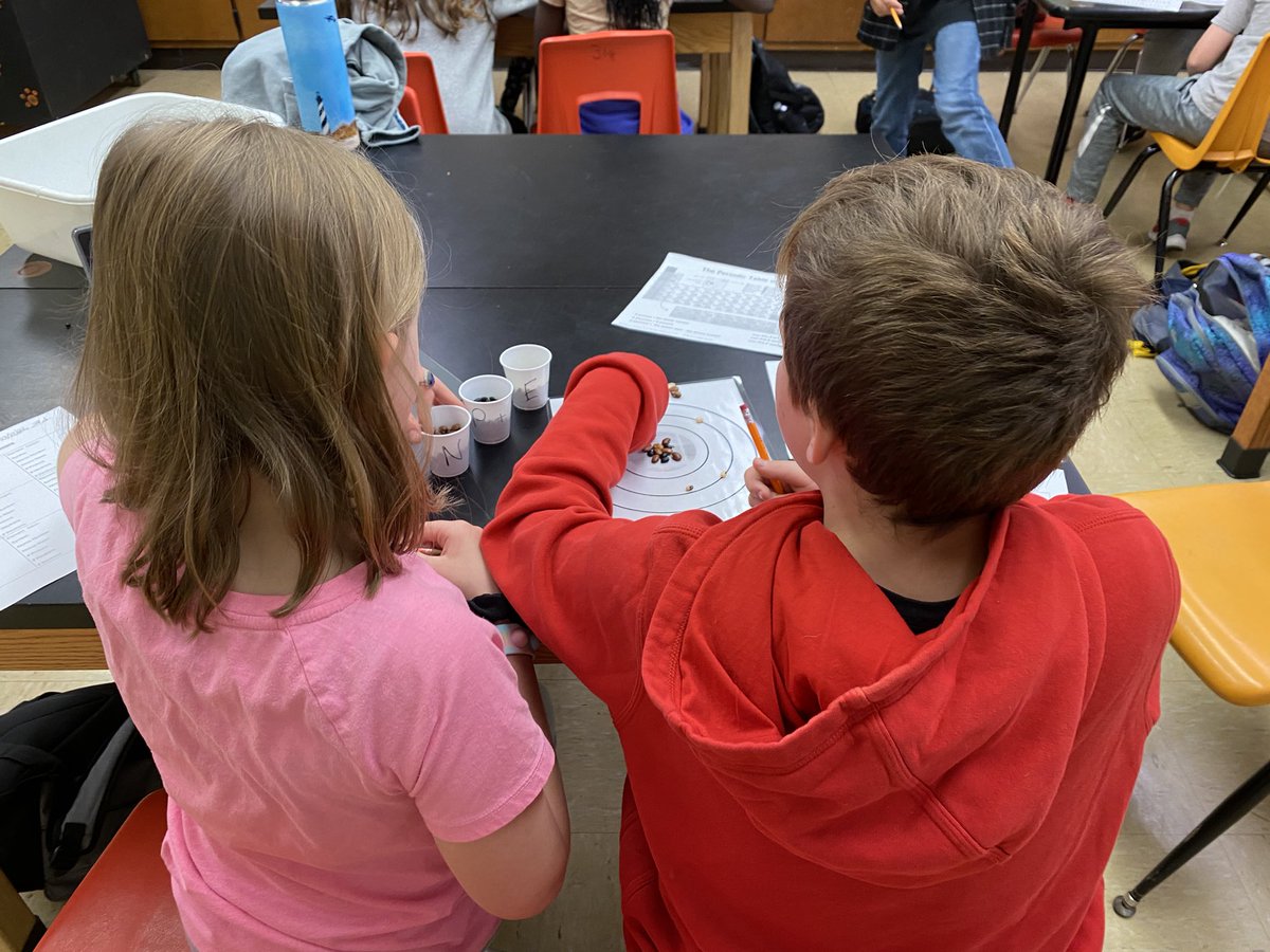 JerryHullTeach's tweet photo. Sixth grade chemists study the periodic table to classify elements and use various beans to represent each sub atomic particle.  @FCPS1Science @TaylorMSTigers #scienceteacher #middleschoolscience https://t.co/i35N3TFX3e