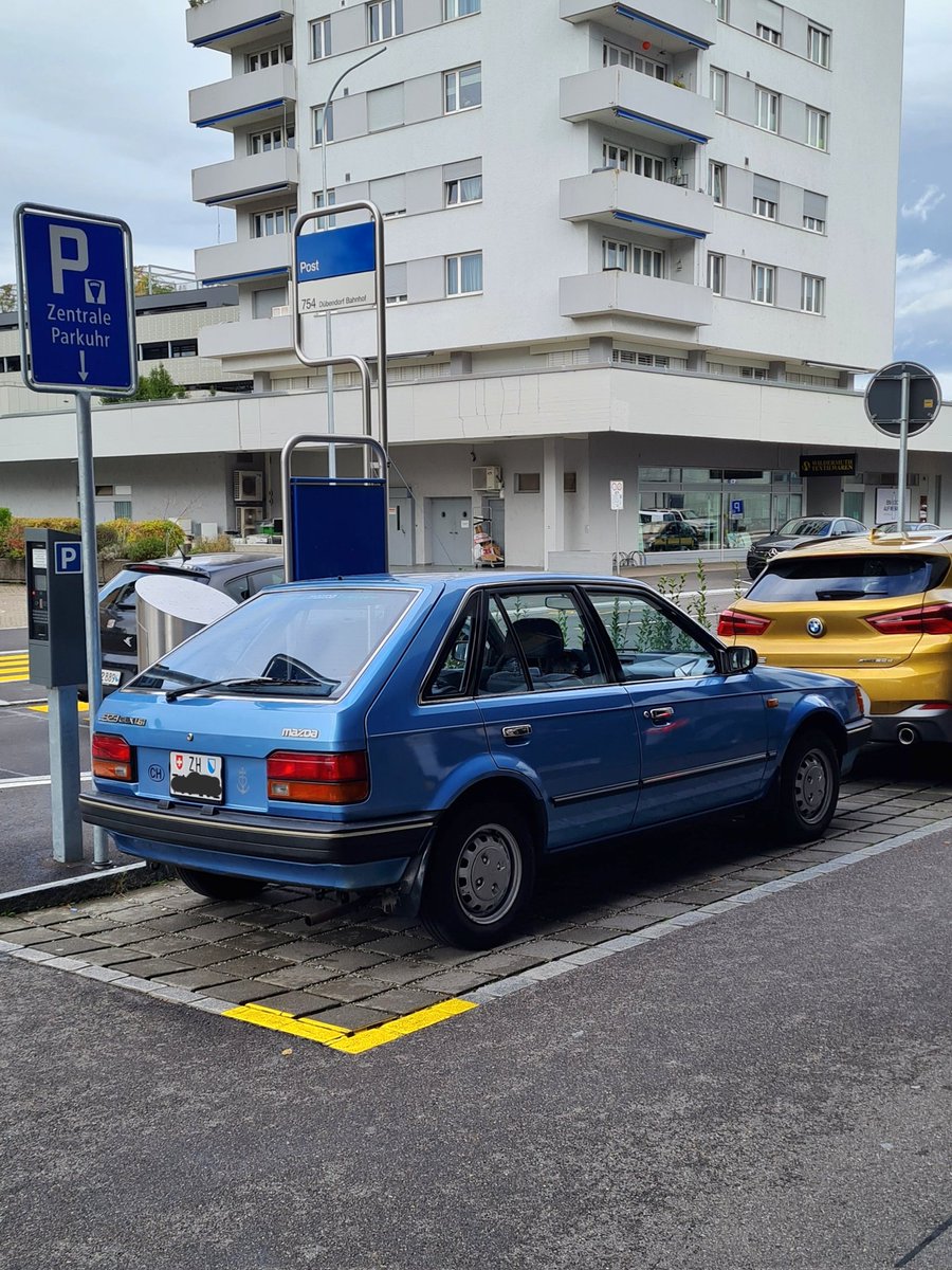Commuter8's tweet photo. Mazda 323 GLX 1.6 in Zurich. Looks like a clean, well-maintained car, I like it! Definitely a rarity these days. @HubNutVids #mazda #hubnut https://t.co/Absn6lmHyF